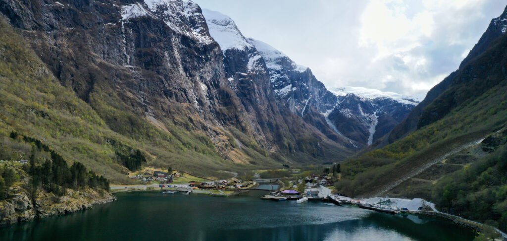 The Nærøyfjord at Gudvangen, sheer rock walls rising out of black water